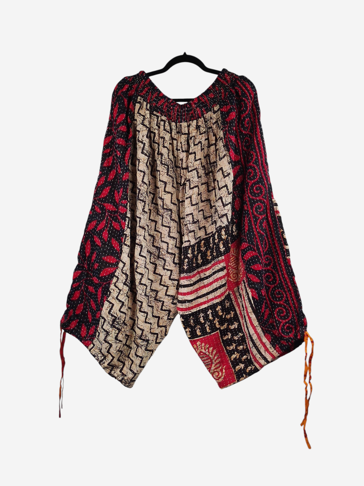 She Lives Beauty vintage cotton kantha cargo joggers in red, black, and beige with bohemian geometric patterns.