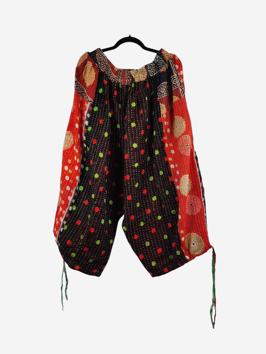 She Lives Beauty vintage cotton kantha cargo joggers in capri length with colorful patchwork patterns on a hanger