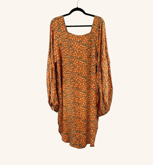 She Lives Beauty Desert Rain silk top in orange and brown with a leaf print, featuring oversized sleeves and hi-low hem.