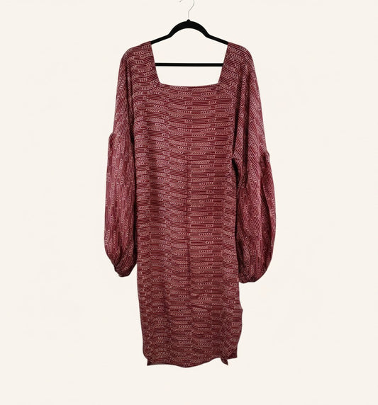 She Lives Beauty Desert Rain silk top in deep red with white geometric patterns, square neckline, and puff sleeves.