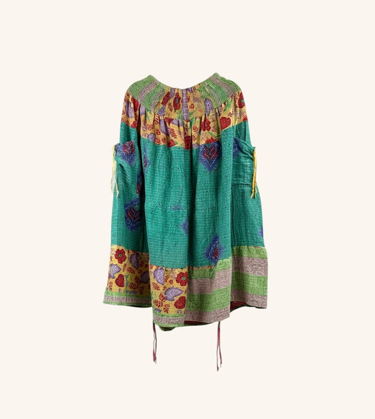 She Lives Beauty Earthbound midi kantha skirt in green vintage cotton with floral patterns and adjustable leg cinches.