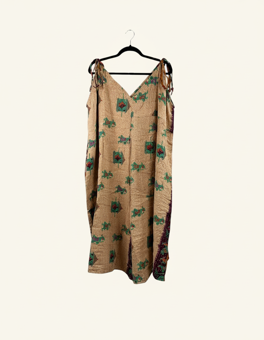 She Lives Beauty Sacred Journey Kantha jumpsuit in tan vintage cotton with green and red floral embroidery details.