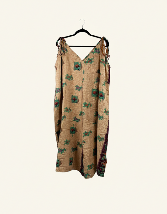 She Lives Beauty Sacred Journey Kantha jumpsuit in tan vintage cotton with green and red floral embroidery details.