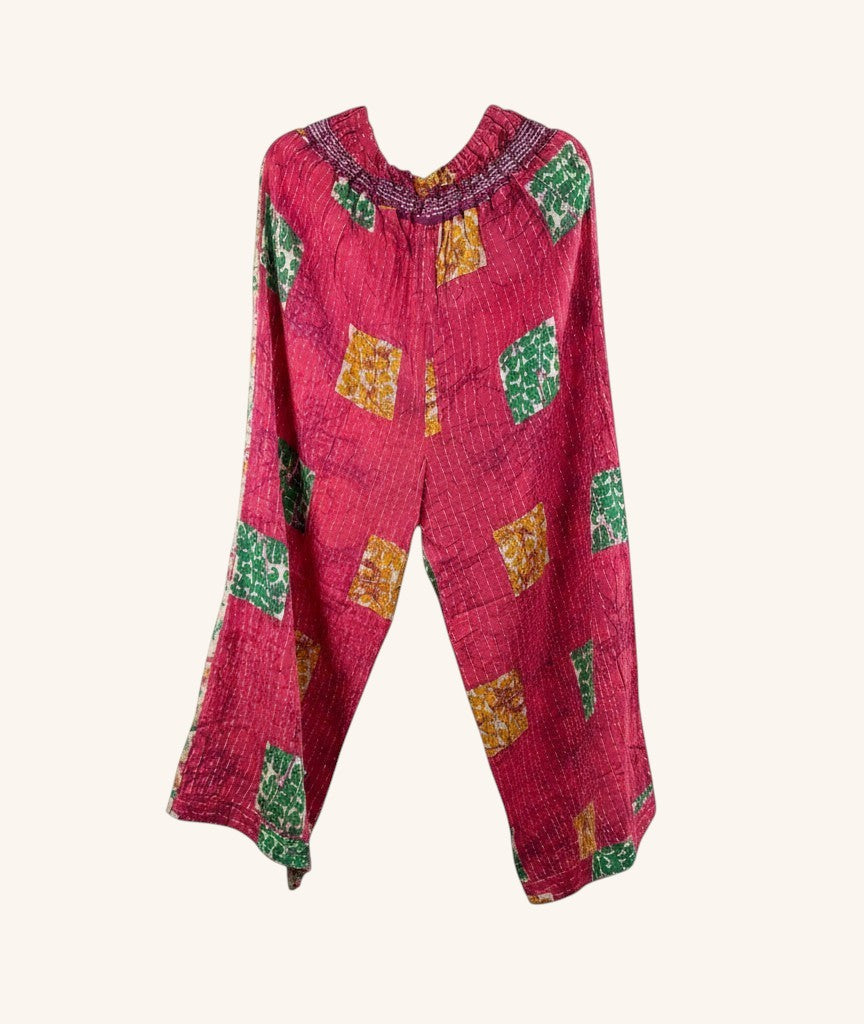 She Lives Beauty wide leg pants in pink vintage kantha cotton with green and yellow patchwork patterns.