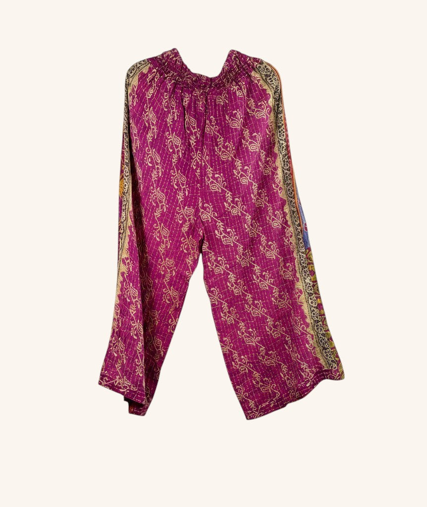 She Lives Beauty wide-leg pants in magenta vintage kantha cotton with intricate hand-stitched floral patterns.