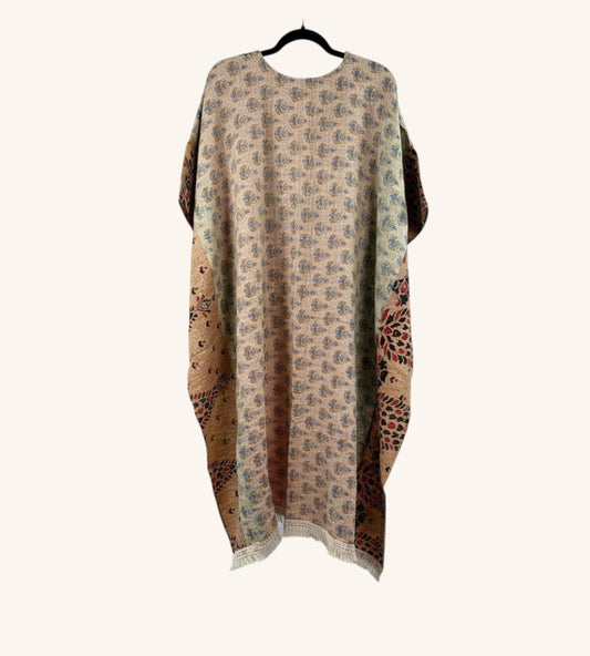 She Lives Beauty reversible Kantha top in vintage cotton with floral patterns, hi-low hem, and fringe detailing.