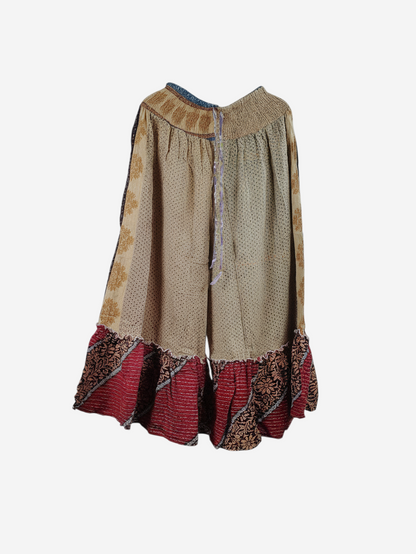She Lives Beauty Anything for Selenas pants in vintage kantha cotton with a neutral print and red ruffled hem.