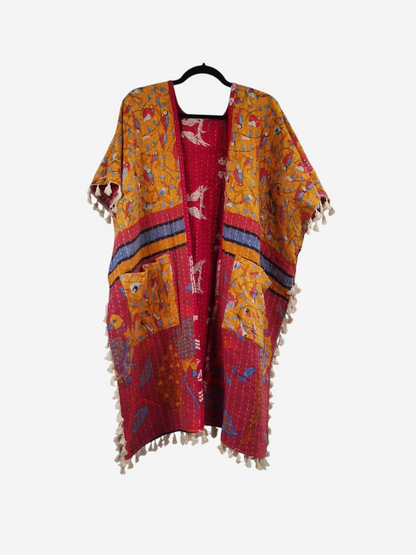 She Lives Beauty vintage cotton kantha kimono in red and yellow with short sleeves, pockets, and artisan fringe trim.