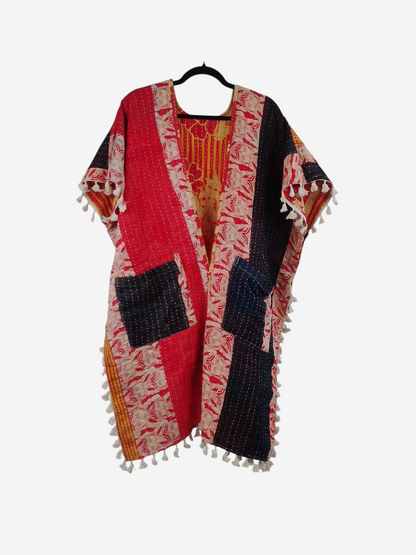 She Lives Beauty short sleeve kimono in vintage kantha cotton with red, black, and floral patterns and fringe trim.