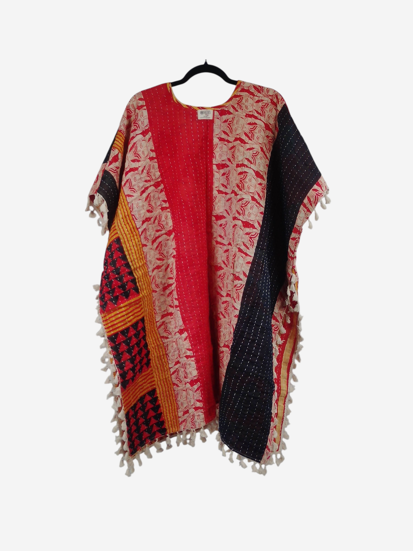 She Lives Beauty short sleeve kimono in vintage kantha cotton with red, black, and yellow patterns and fringe trim.