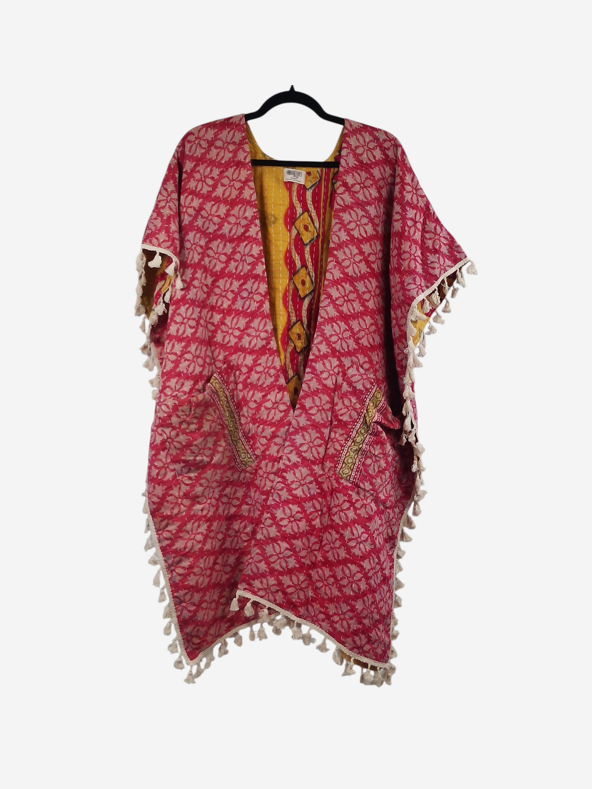 She Lives Beauty vintage cotton kantha kimono in pink and yellow with floral patterns and artisan fringe trim