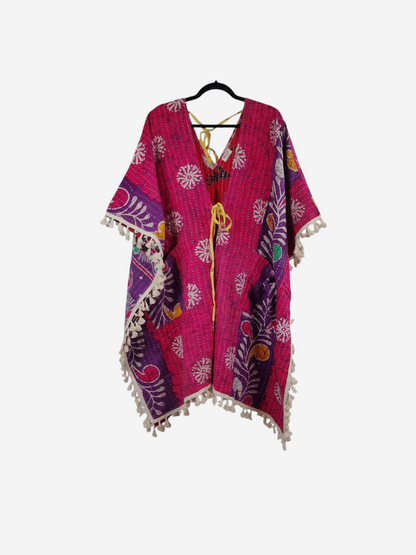 She Lives Beauty reversible pink kantha kimono with floral patterns, long sleeves, and cream fringe trim.