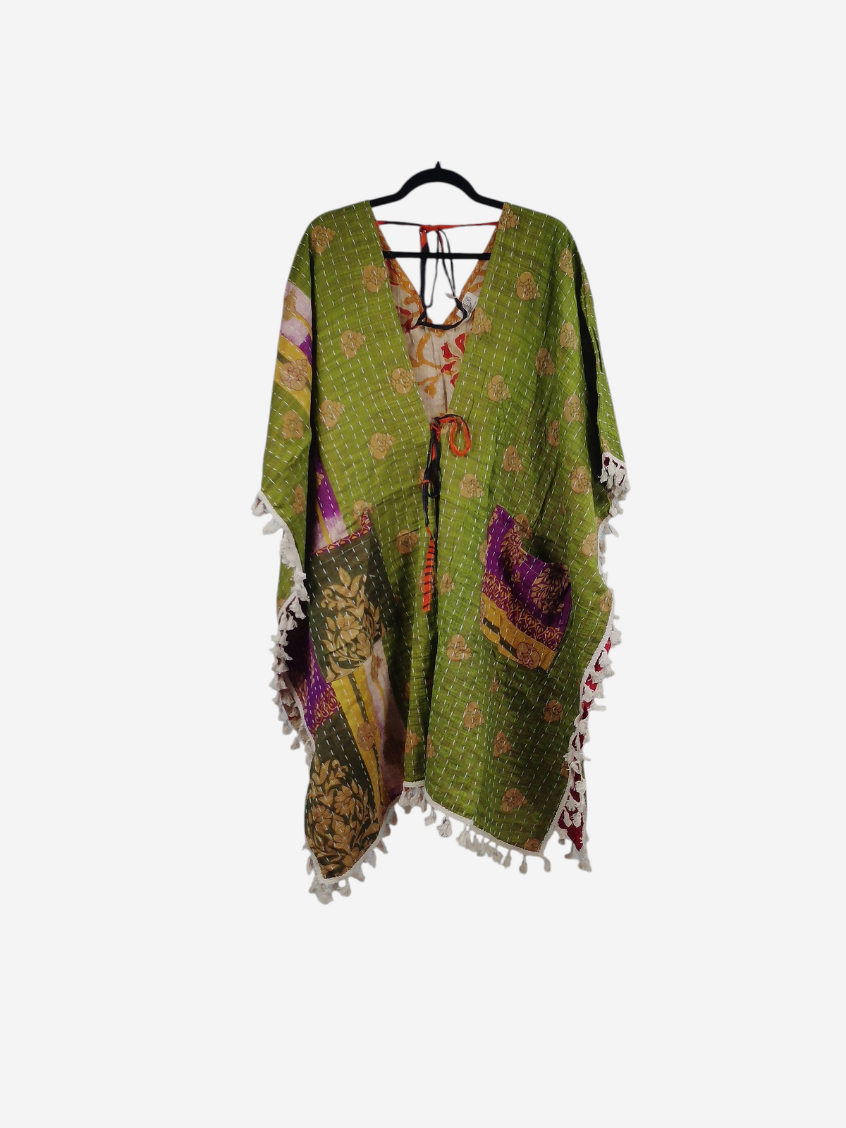 She Lives Beauty reversible green kantha kimono with long sleeves, fringe trim, and vintage cotton sari patchwork.