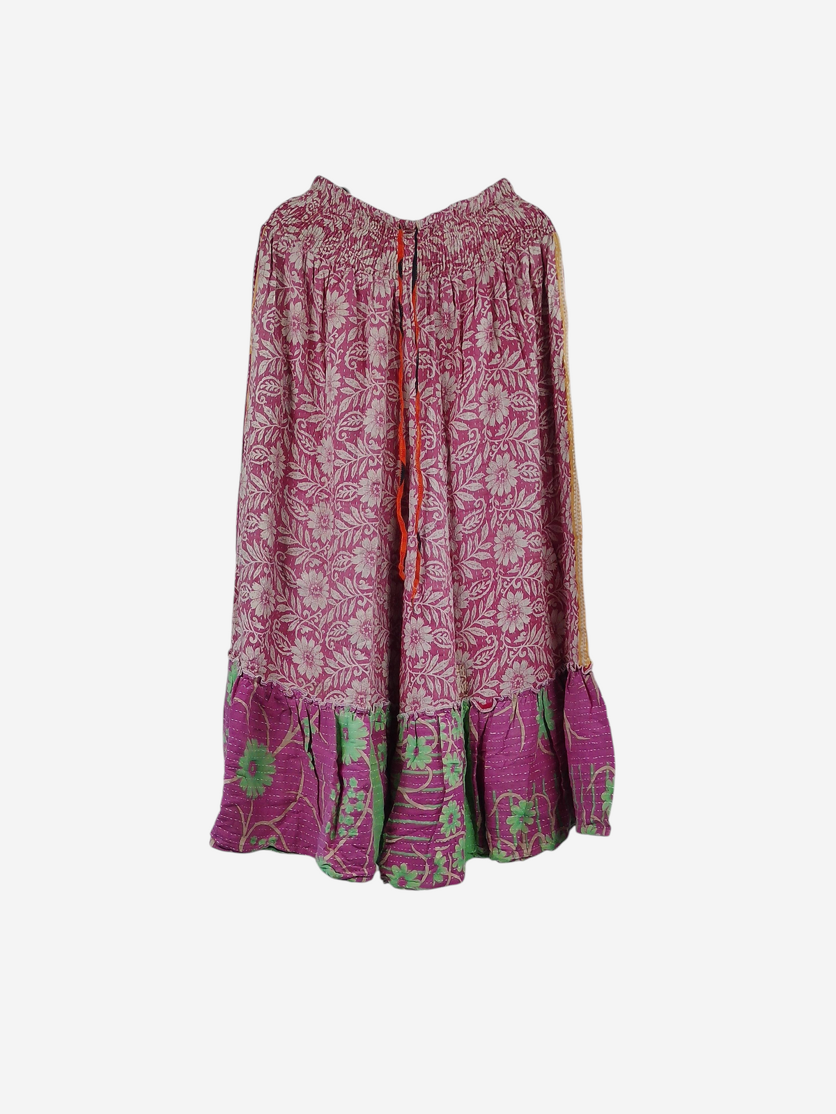 She Lives Beauty Anything for Selenas pants in pink floral vintage kantha cotton with a ruffled hem on a hanger.