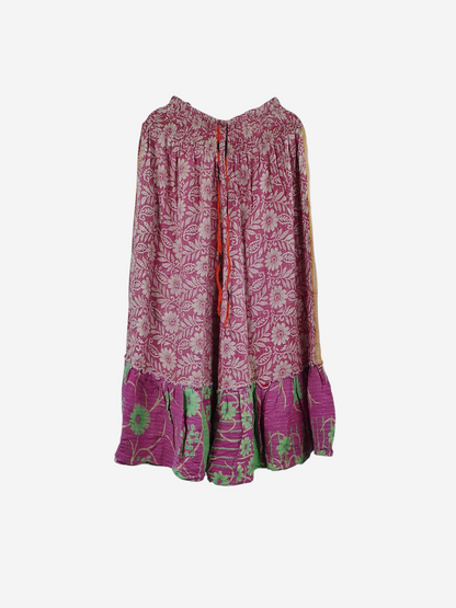 She Lives Beauty Anything for Selenas pants in pink floral vintage kantha cotton with a ruffled hem on a hanger.