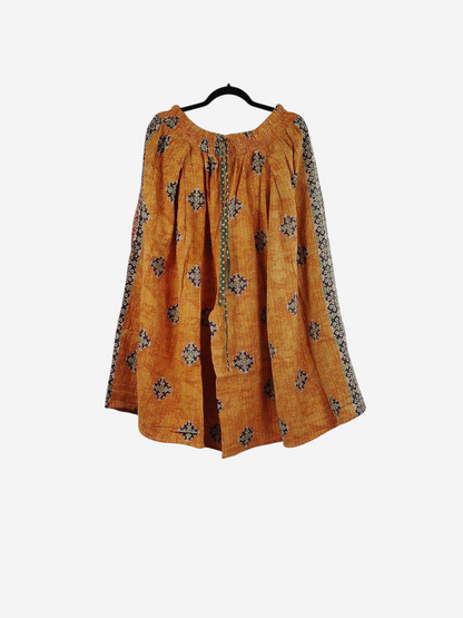 She Lives Beauty Pachuco Kantha capri pants in orange vintage cotton with intricate black and white geometric patterns.