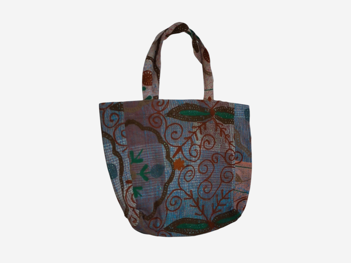 She Lives Beauty Soul Traveler Kantha Suzani bag featuring vintage patchwork cotton with intricate floral embroidery