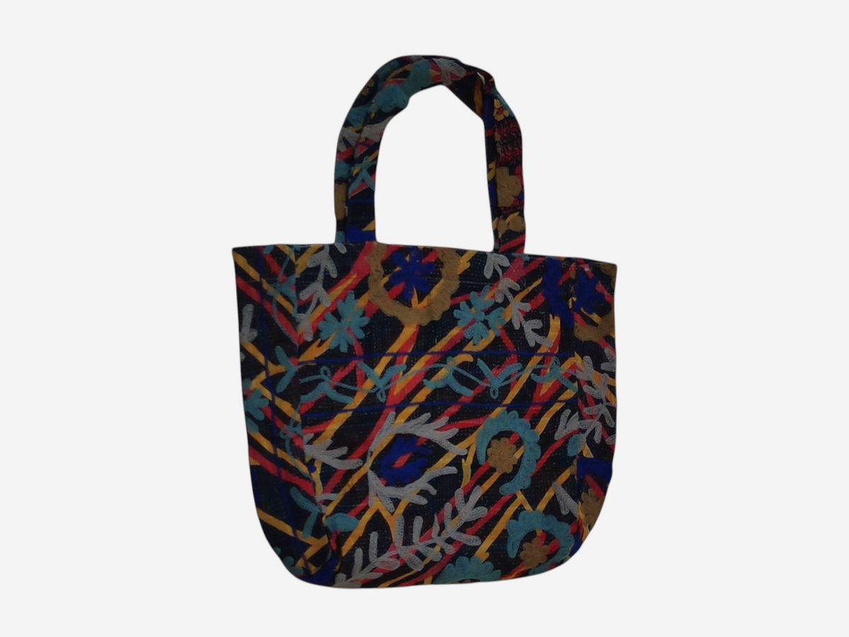 She Lives Beauty bohemian Kantha Suzani tote bag featuring vibrant patchwork embroidery on dark vintage cotton fabric