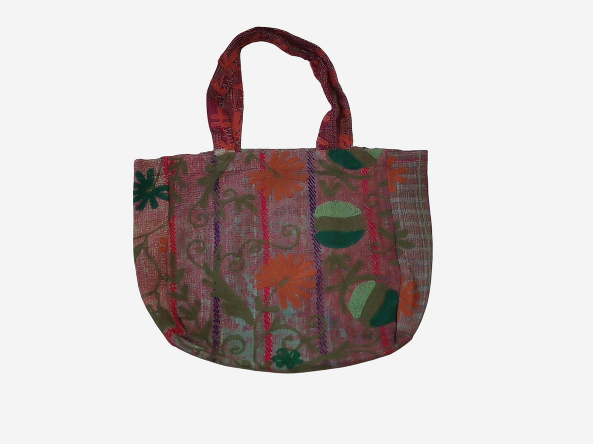 She Lives Beauty vintage Kantha and Suzani cotton tote bag with floral embroidery and patchwork in faded red tones.