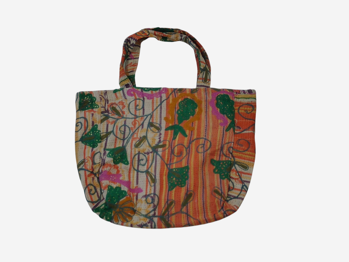 She Lives Beauty bohemian tote bag made from vintage cotton Kantha and Suzani patchwork with colorful embroidery.