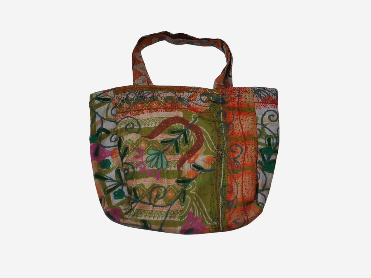 She Lives Beauty vintage Kantha and Suzani patchwork tote bag featuring colorful floral embroidery on cotton fabric