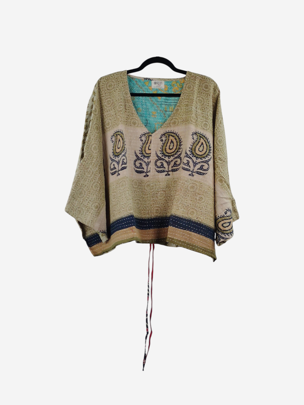 She Lives Beauty Sunrise Hana butterfly top in vintage cotton with paisley prints and kantha stitching on a hanger.