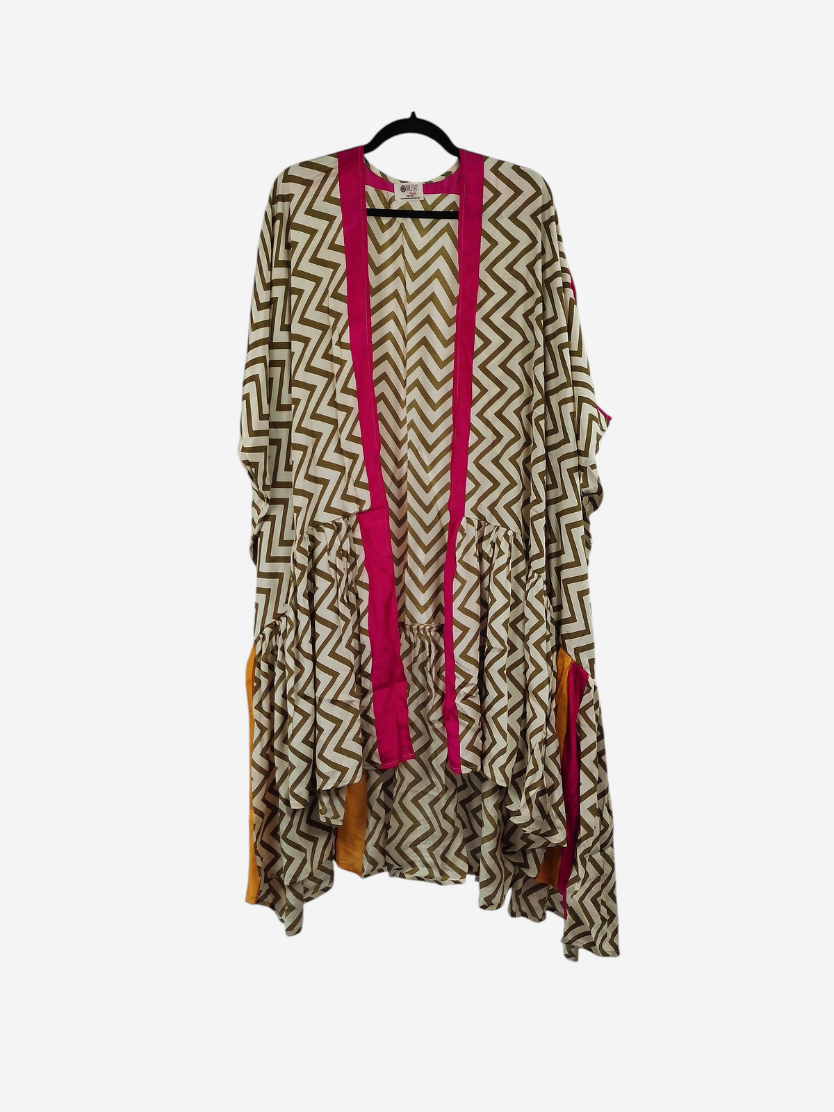 She Lives Beauty Winds of the Ancestors kimono in a beige and white chevron silk blend with vibrant pink trim.