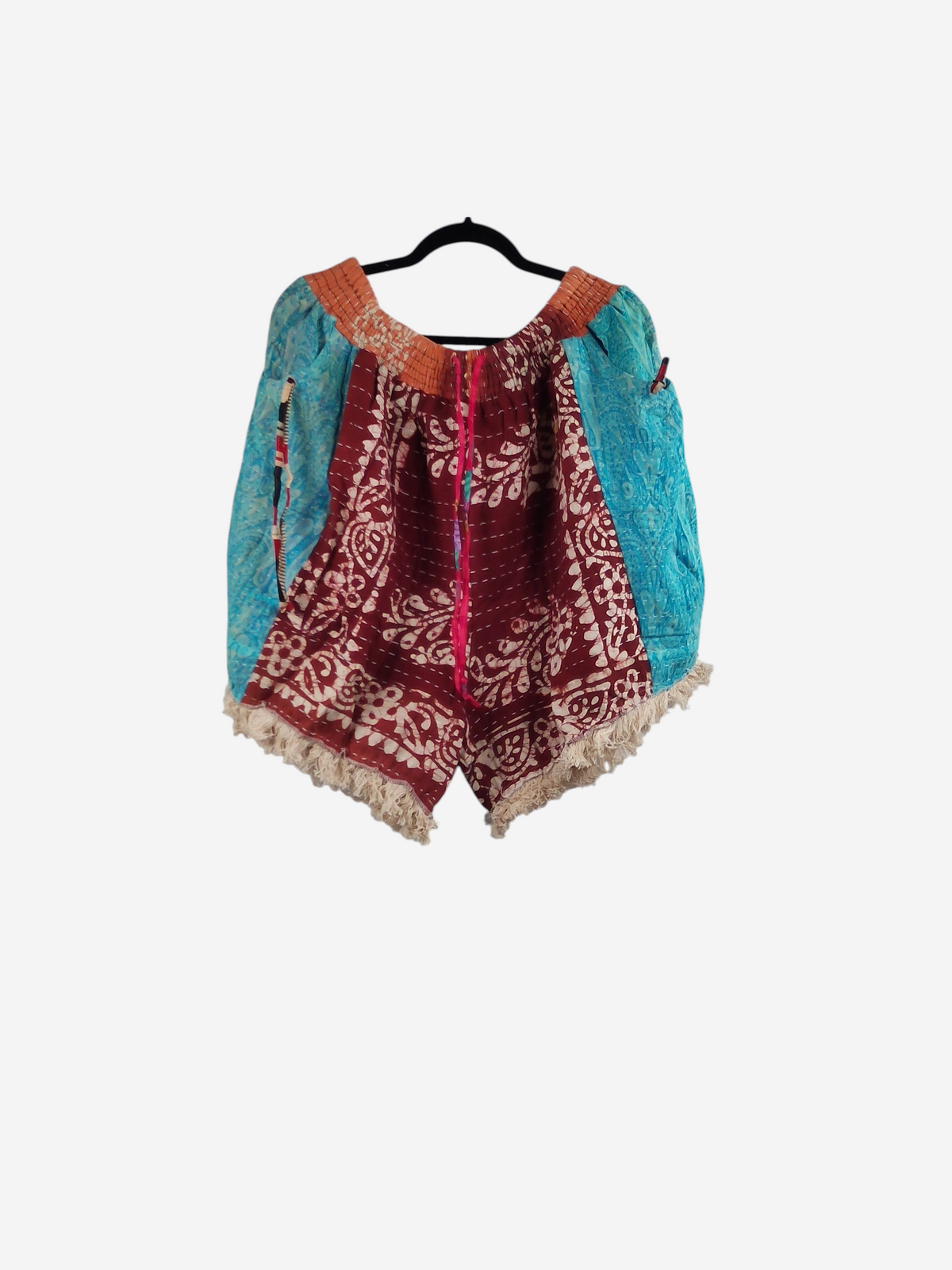 She Lives Beauty Alma Kantha fringe shorts in vintage cotton with a patchwork of teal and burgundy floral patterns.