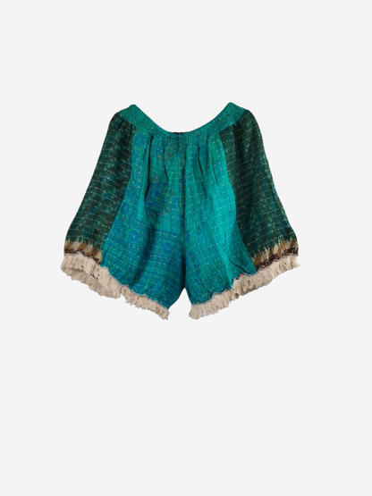 She Lives Beauty Alma Kantha fringe shorts in teal vintage cotton with unique stitching and cream-colored fringe.