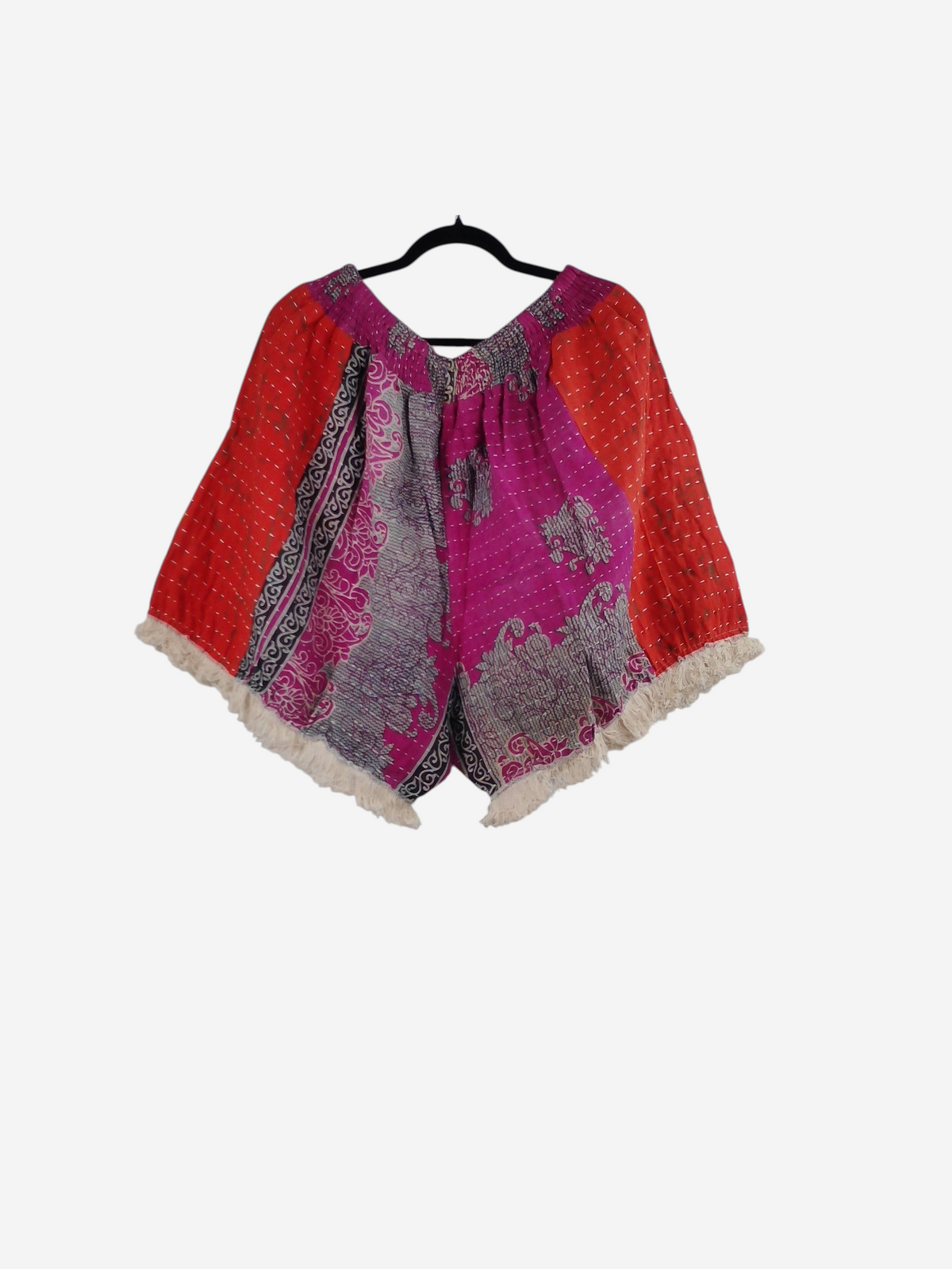 She Lives Beauty Alma Kantha fringe shorts in vibrant red and pink vintage cotton with unique patterned stitching.