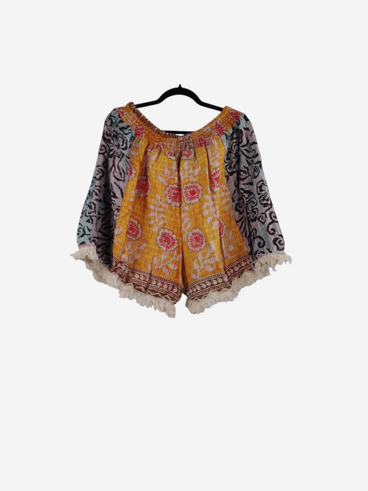 She Lives Beauty Alma Kantha fringe shorts in yellow and multi-colored vintage cotton with boho floral patterns.