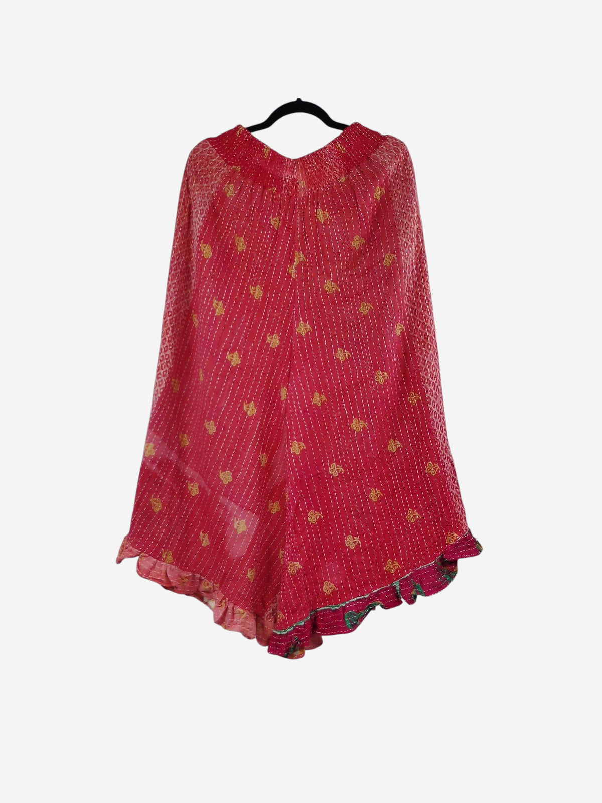 She Lives Beauty Laila capri ruffle pants in red vintage Kantha cotton with yellow floral patterns and flared hem.