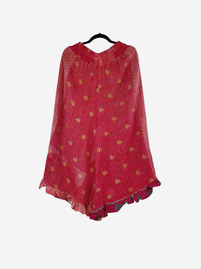 She Lives Beauty Laila capri ruffle pants in red vintage Kantha cotton with yellow floral patterns and flared hem.
