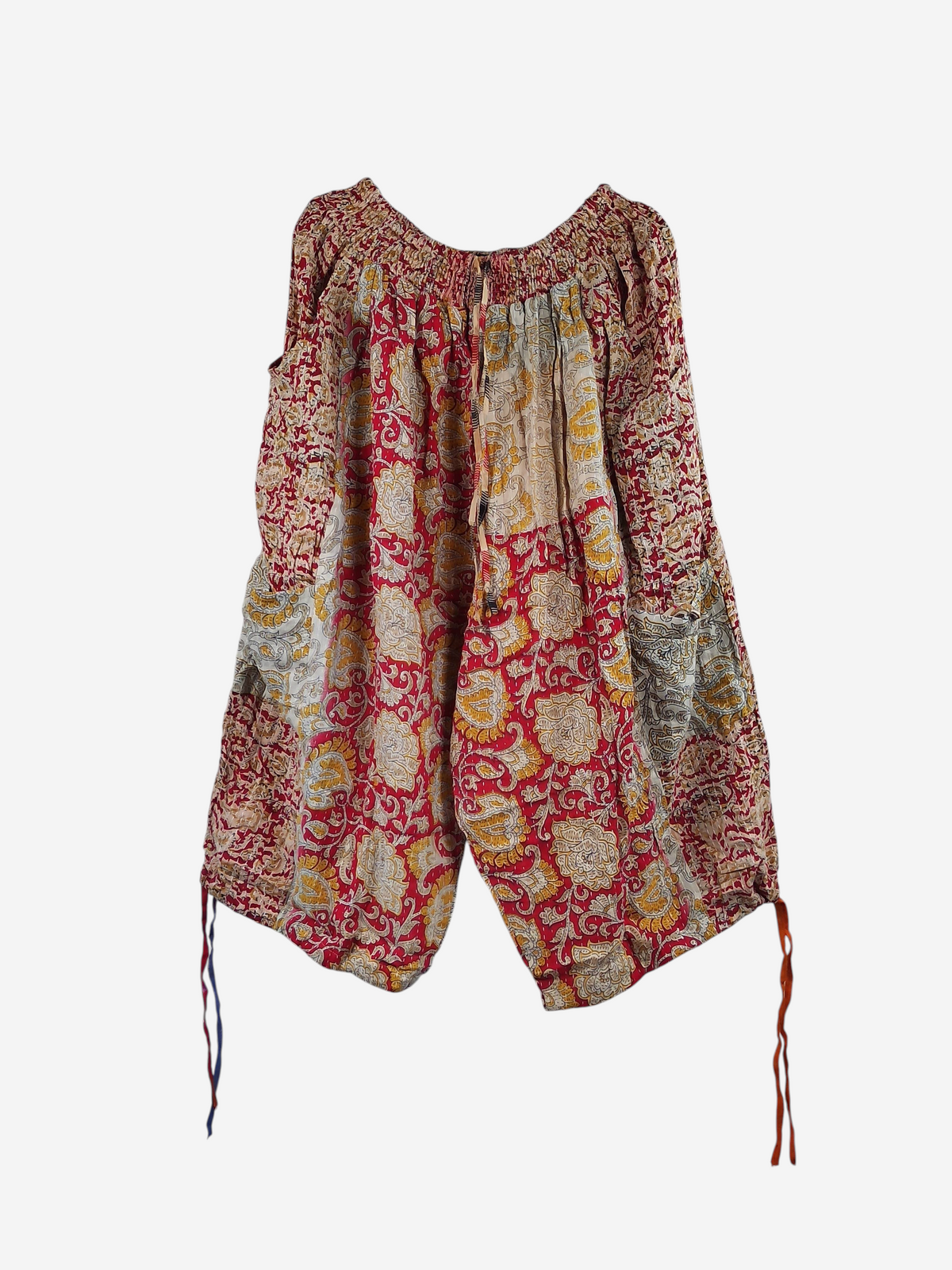 She Lives Beauty vintage cotton kantha cargo jogger capris in red and yellow floral patterns on a hanger.
