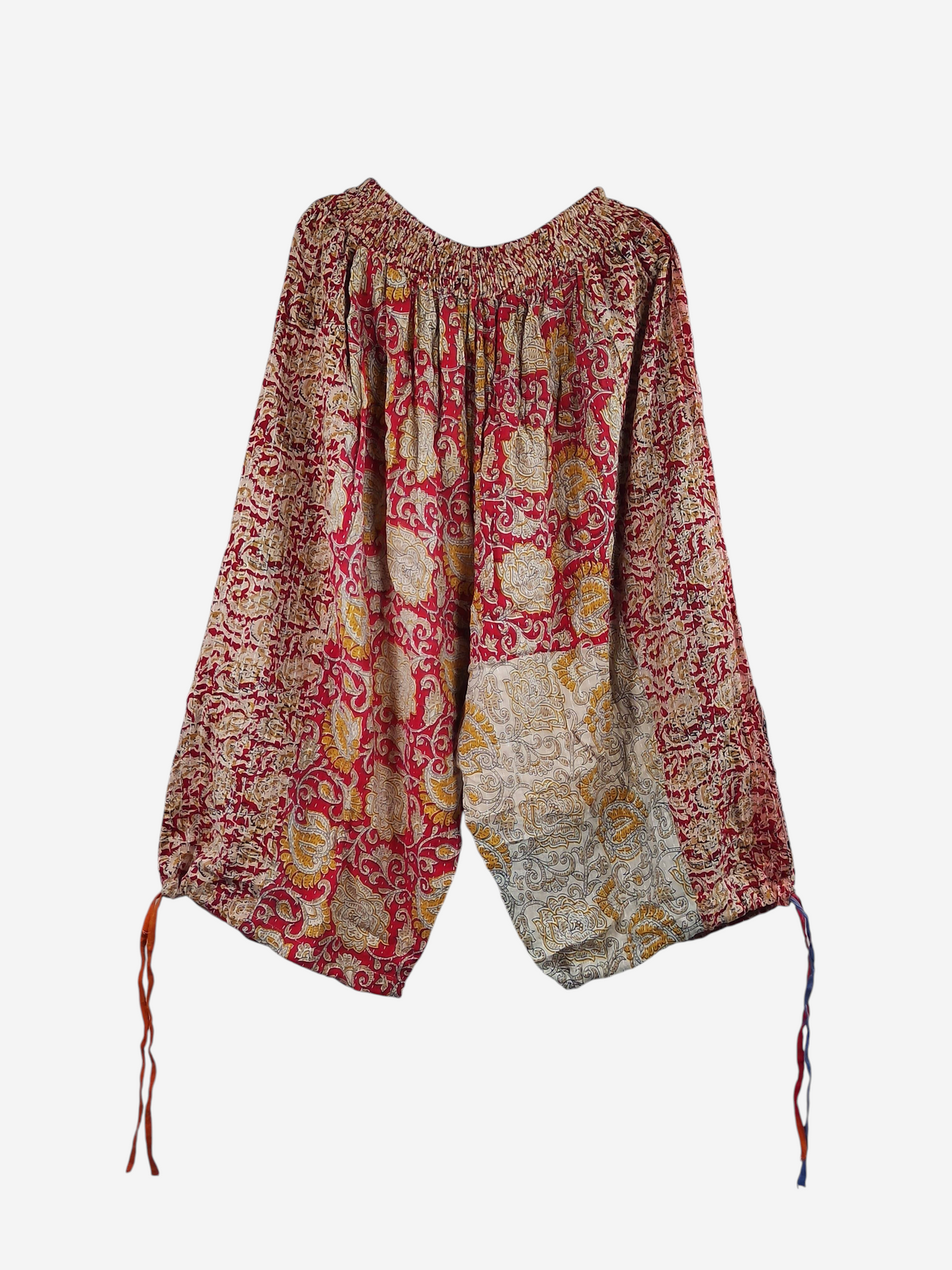 She Lives Beauty vintage cotton kantha capri joggers in red and yellow with bohemian floral patterns and tie cuffs.