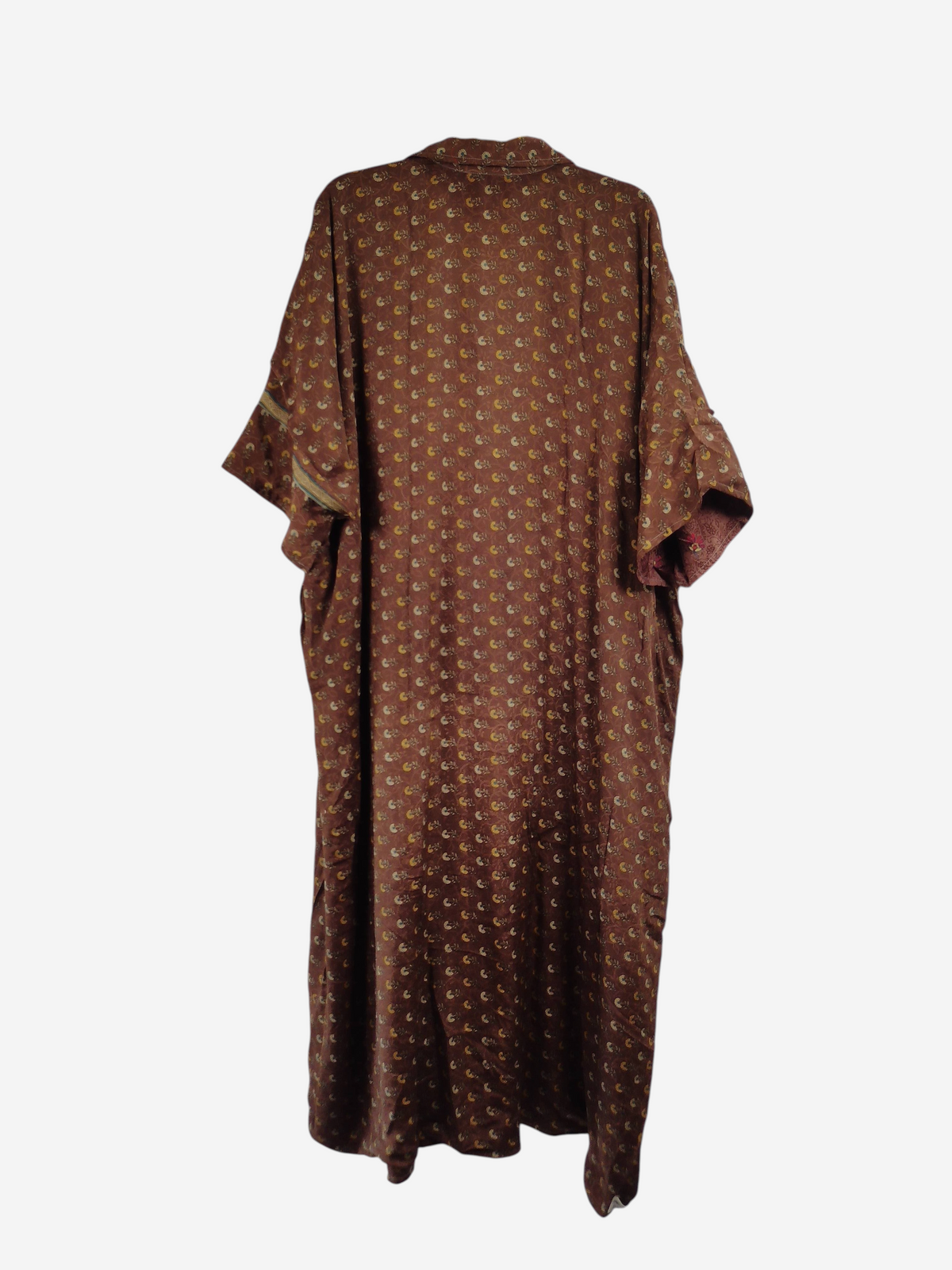 She Lives Beauty reversible kaftan in brown vintage Rasgulla silk with a small floral pattern, hanging on a hanger.