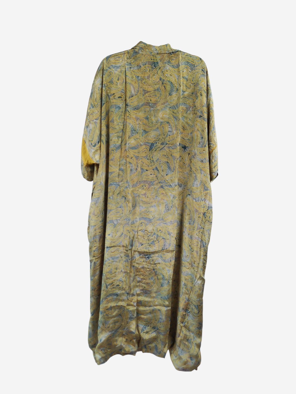 She Lives Beauty reversible kaftan in yellow vintage rasgulla silk with a flowing bohemian pattern on a hanger.