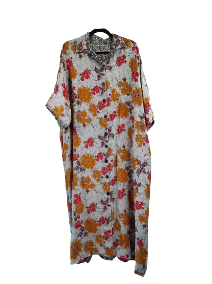 She Lives Beauty reversible kaftan in vintage floral Rasgulla silk with a button-front and relaxed bohemian fit.