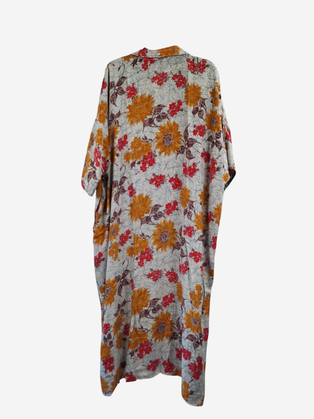 She Lives Beauty reversible kaftan in vintage Rasgulla silk with a cream base and orange and red floral pattern.