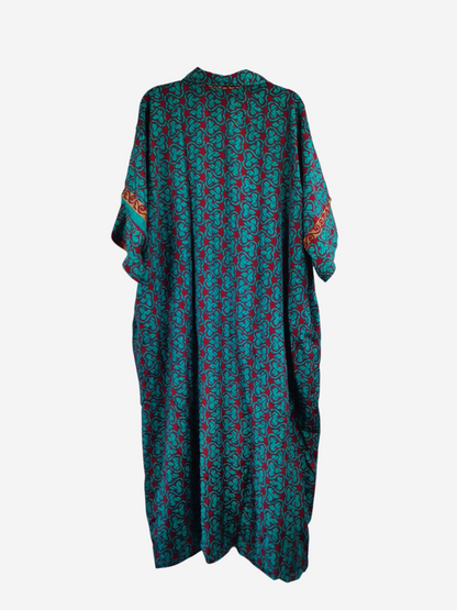 She Lives Beauty reversible kaftan in vintage rasgulla silk with a teal and red geometric pattern on a hanger