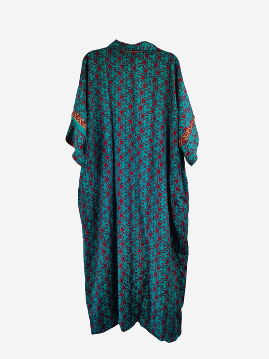 She Lives Beauty reversible kaftan in vintage rasgulla silk with a teal and red geometric pattern on a hanger