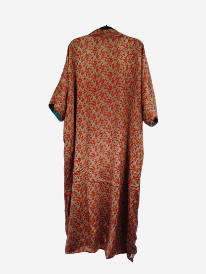 She Lives Beauty reversible kaftan in vintage Rasgulla silk with a vibrant floral pattern and flowing silhouette.