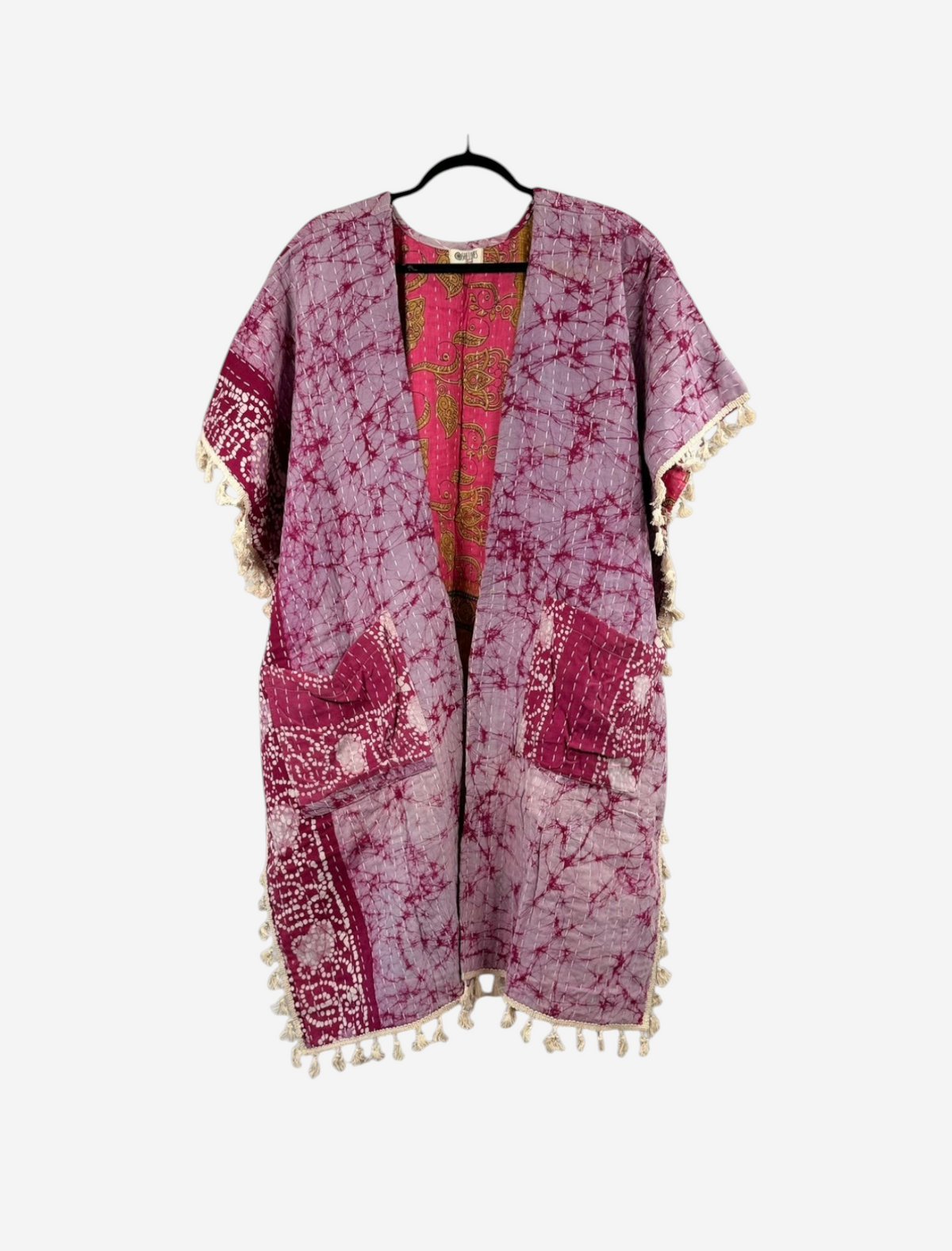 She Lives Beauty vintage cotton kantha kimono in purple and pink with short sleeves, fringe trim, and open front.