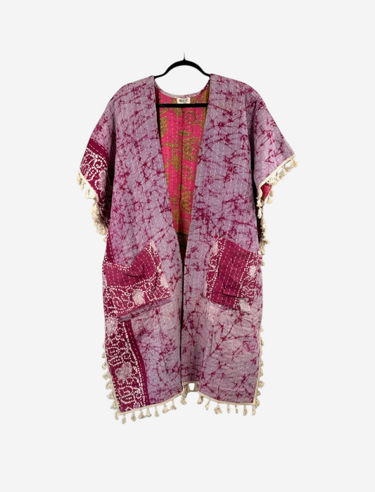 She Lives Beauty vintage cotton kantha kimono in purple and pink with short sleeves, fringe trim, and open front.