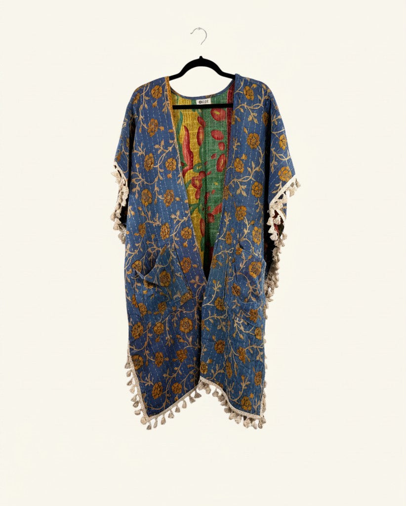 She Lives Beauty blue floral kantha kimono with short sleeves, fringe trim, and vintage cotton stitching.