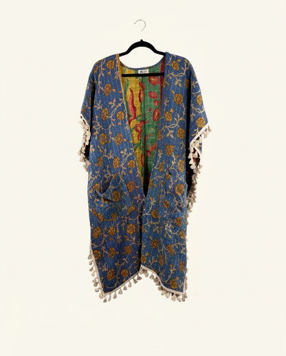 She Lives Beauty blue floral kantha kimono with short sleeves, fringe trim, and vintage cotton stitching.
