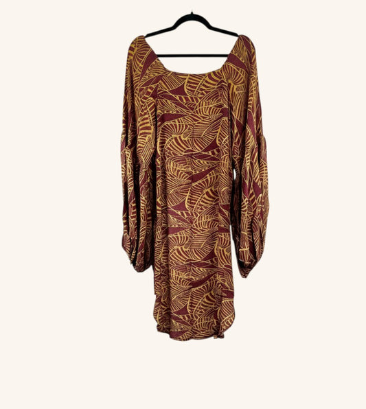She Lives Beauty Desert Rain silk top in maroon and gold with a leaf print, featuring dramatic oversized sleeves.