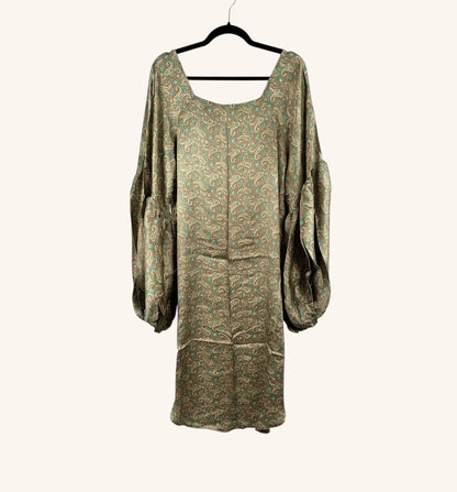 She Lives Beauty Desert Rain silk top with paisley print, oversized ruffle sleeves, and a flowing hi-low silhouette.