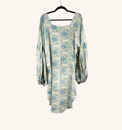She Lives Beauty Desert Rain silk top in blue and cream paisley print with oversized ruffle sleeves and hi-low hem.