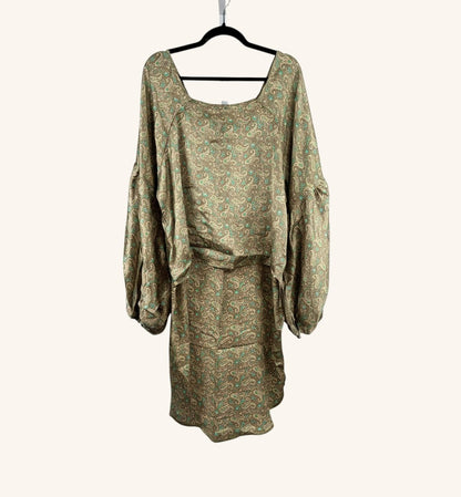 She Lives Beauty Desert Rain silk top in tan and teal paisley print with oversized ruffle sleeves and hi-low hem.